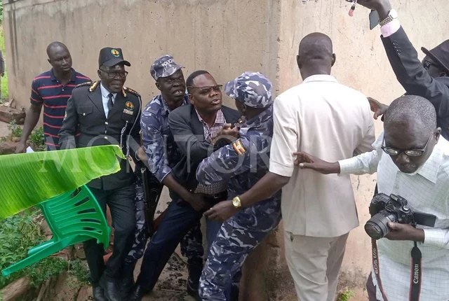 AMBASSADOR PULLS OUT PISTOL TO SHOOT LANGO CULTURAL LEADERS AFTER BEING TOLD TO EXIT MEETING, POLICE FORCEFULLY DISARMS HIM.